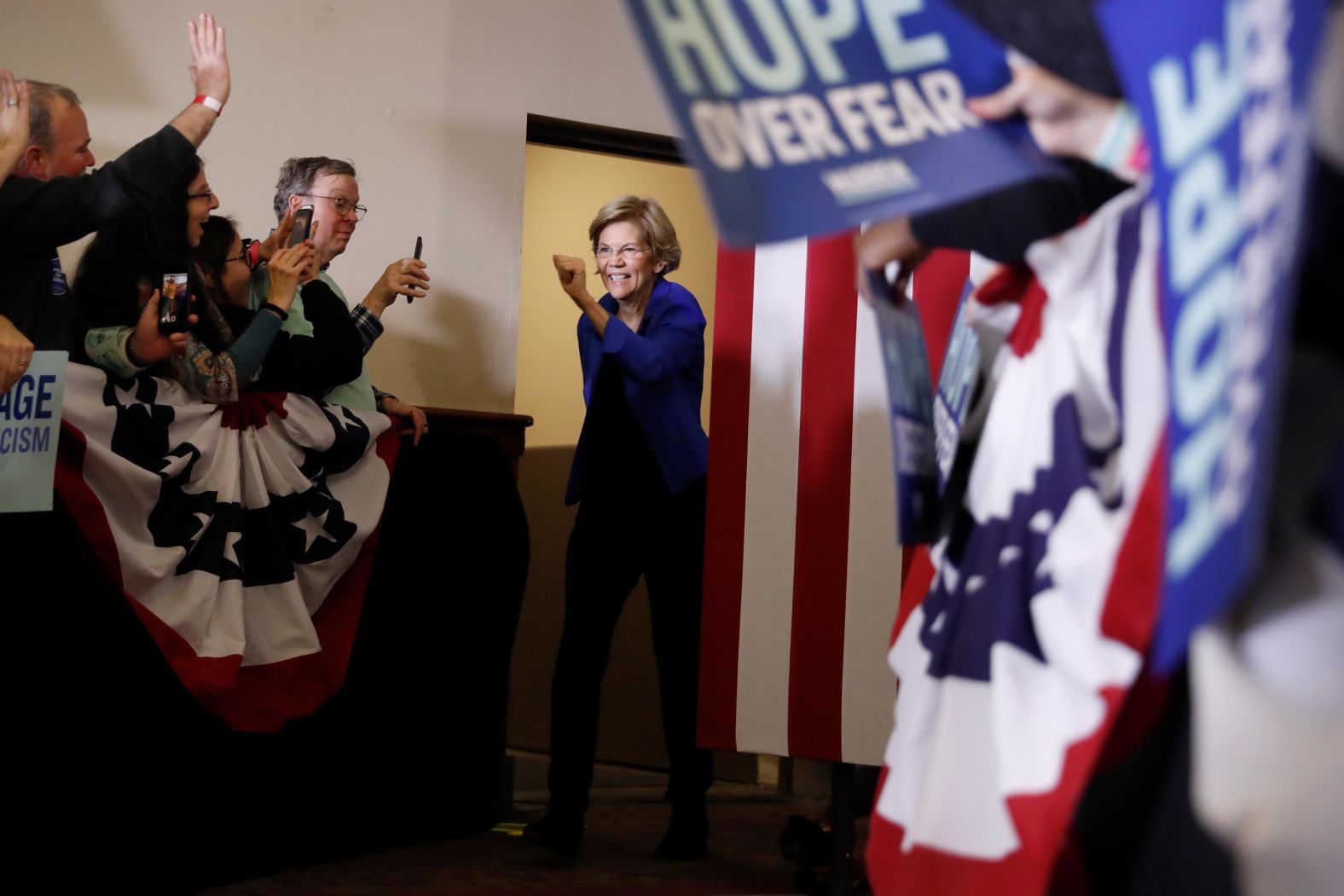 US Sen. Elizabeth Warren takes the stage to address supporters at her caucus-night party in Des Moines.