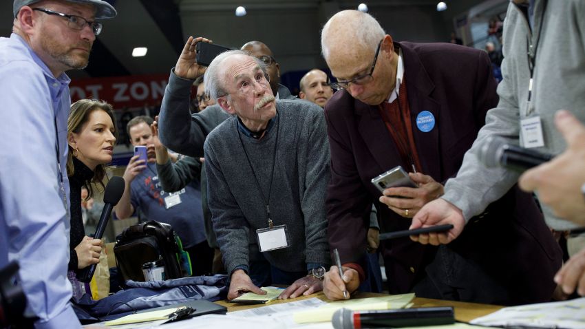 DES MOINES, IA - FEBRUARY 03: Officials from the 68th caucus precinct overlook the results of the first referendum count during a caucus event on February 3, 2020 at Drake University in Des Moines, Iowa, United States. Iowa is the first contest in the 2020 presidential nominating process with the candidates then moving on to New Hampshire. (Photo by Tom Brenner/Getty Images)