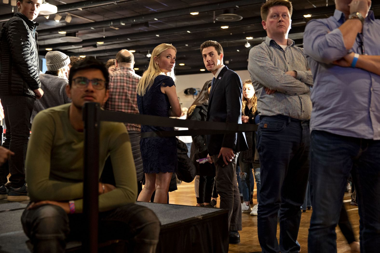 Staff members who work for the campaign of presidential candidate Joe Biden wait for results during a caucus-night watch party in Des Moines on February 3.
