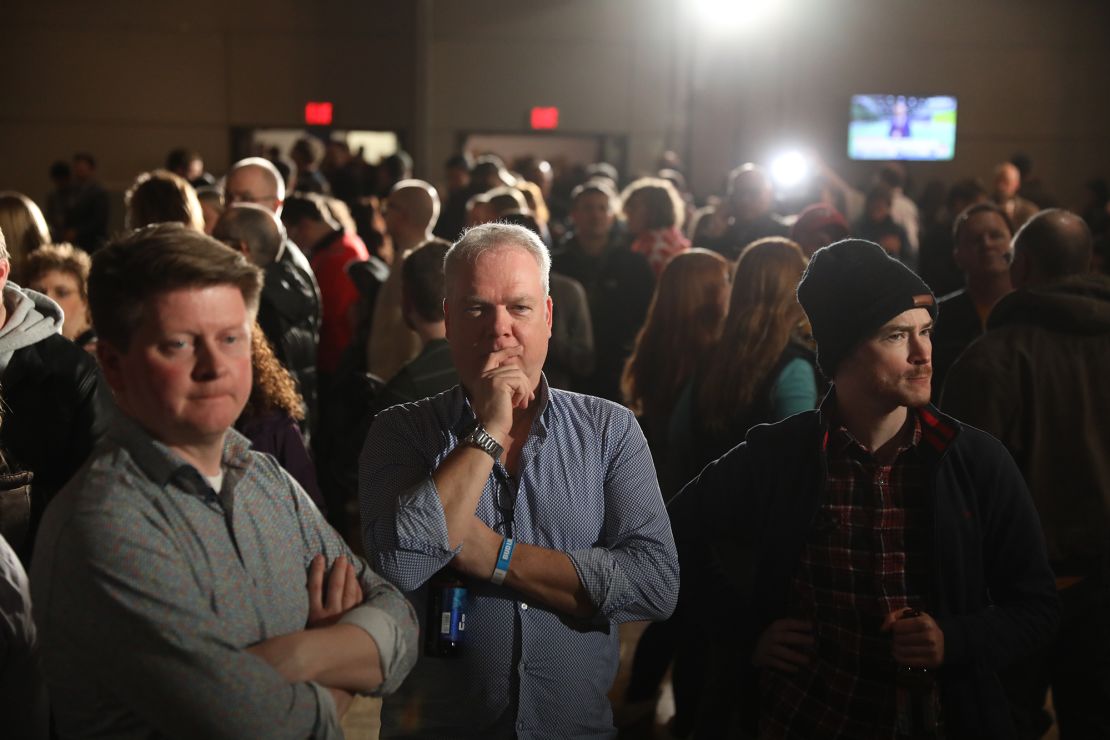 Supporters of former U.S. Vice President Joe Biden, 2020 Democratic presidential candidate, wait for results during a caucus night watch party in Des Moines, Iowa.