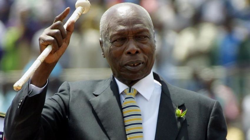 NAIROBI, KENYA:  Kenya's former president, Daniel Arap Moi, waves to the crowd while he enters in the National Stadium to celebrates Moi's day in Nairobi Kenya 10 October, 2001. Moi has been heading Kenya for 23 years. AFP PHOTO/Pedro UGARTE (Photo credit should read PEDRO UGARTE/AFP via Getty Images)