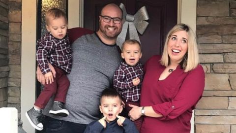 The Navarra family of five in front of their home.