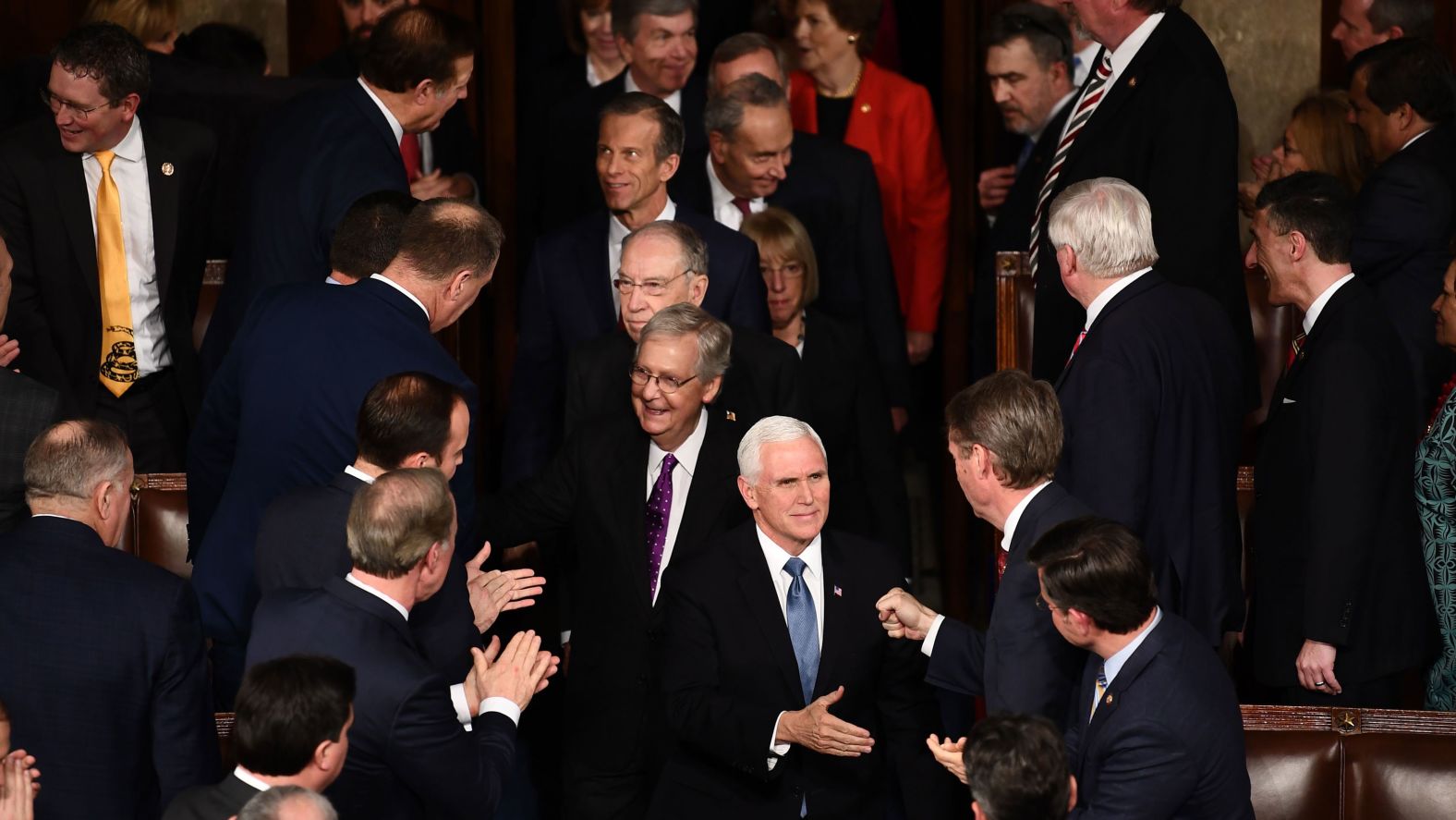 Pence and Senate Majority Leader Mitch McConnell greet members of the House as they walk into the chamber.