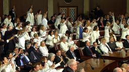 lawmakers three fingers raised