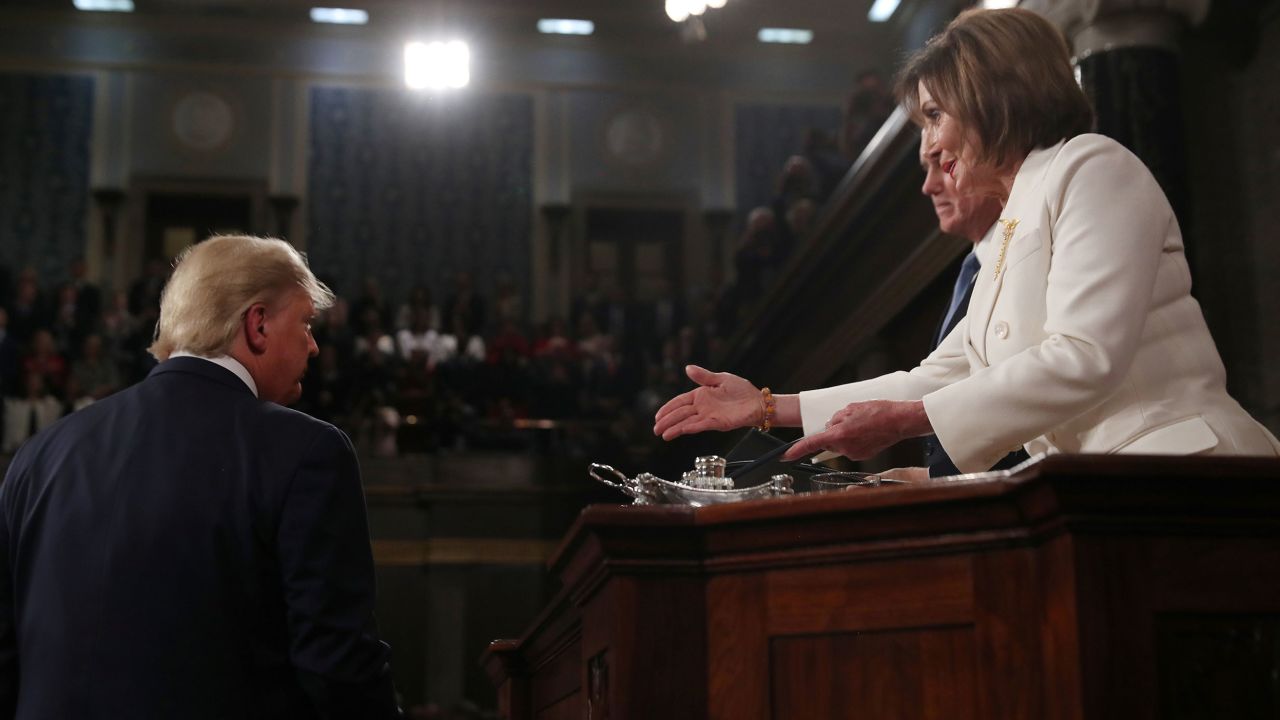 President Donald Trump turns away as Speaker of the House Nancy Pelosi reaches out to shake his hand as he arrives to deliver his State of the Union address to a joint session of the U.S. Congress in the House Chamber of the U.S. Capitol in Washington, U.S. February 4, 2020. REUTERS/Leah Millis/POOL