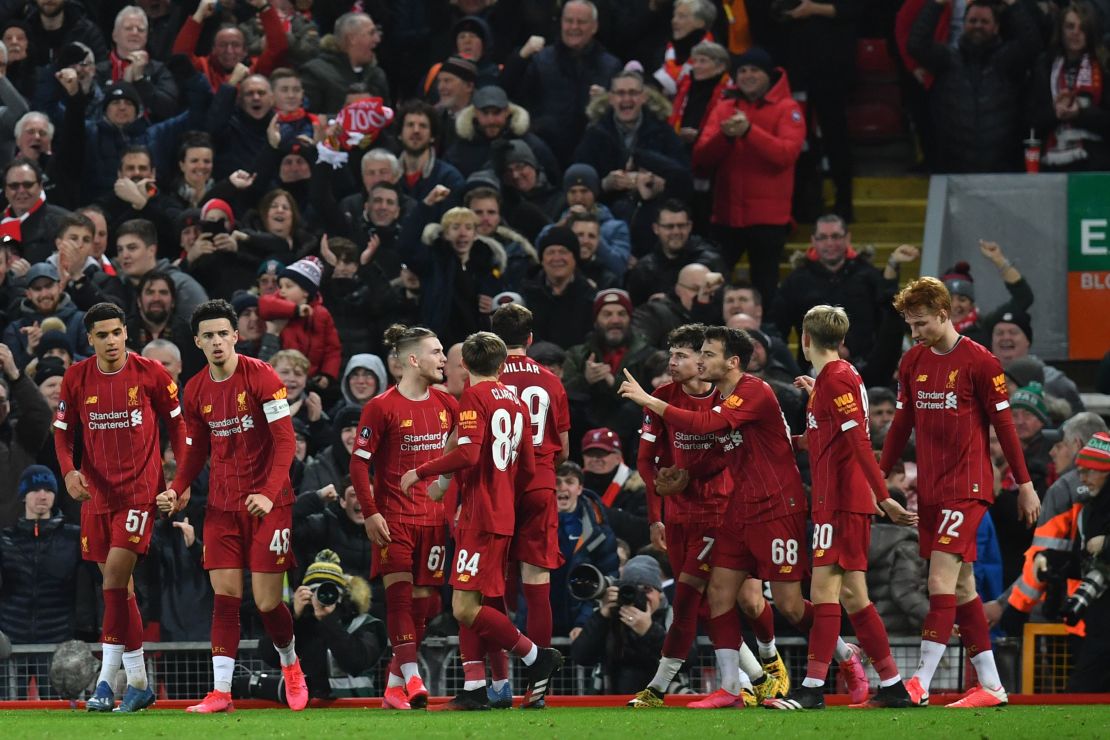 Liverpool players celebrate taking the leadagainst Shrewsbury Town.