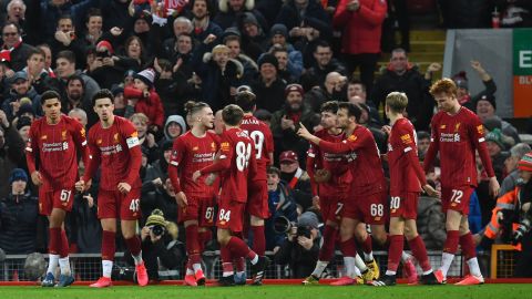 Liverpool players celebrate taking the leadagainst Shrewsbury Town.