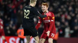 Liverpool's Irish goalkeeper Caoimhin Kelleher (L) and Liverpool's Dutch defender Sepp van den Berg (R) celebrate their victory on the pitch after the English FA Cup fourth round reply football match between Liverpool and Shrewsbury Town at Anfield in Liverpool, north west England on February 4, 2020. - Liverpool won the game 1-0. (Photo by Paul ELLIS / AFP) / RESTRICTED TO EDITORIAL USE. No use with unauthorized audio, video, data, fixture lists, club/league logos or 'live' services. Online in-match use limited to 120 images. An additional 40 images may be used in extra time. No video emulation. Social media in-match use limited to 120 images. An additional 40 images may be used in extra time. No use in betting publications, games or single club/league/player publications. /  (Photo by PAUL ELLIS/AFP via Getty Images)