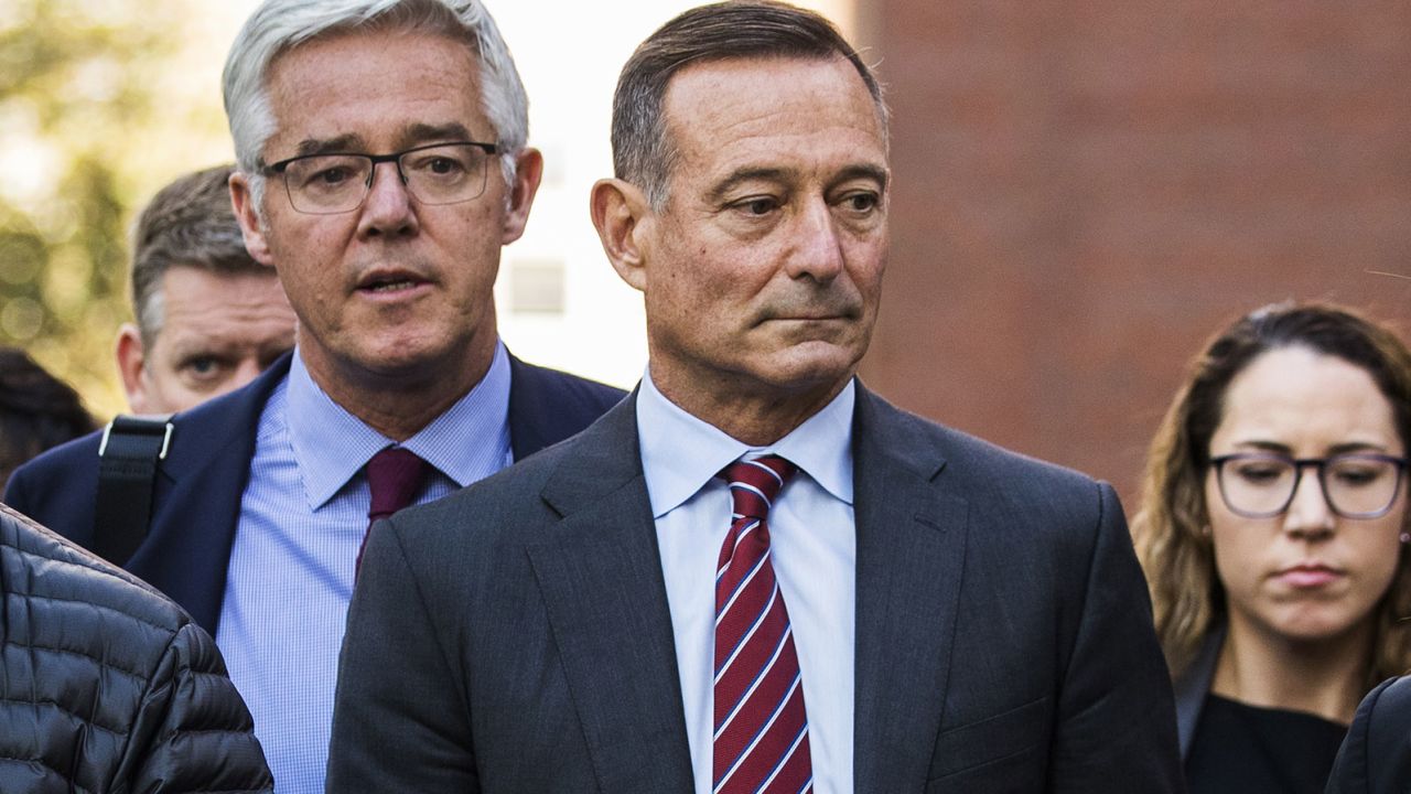 Douglas Hodge, former CEO of PIMCO, exits federal court on October 21, 2019, in Boston.