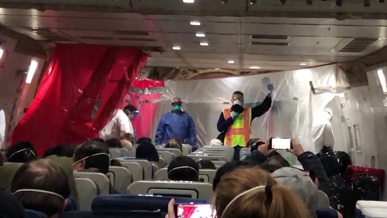 A man makes an announcement aboard the evacuation flight that US citizens were on Wednesday.