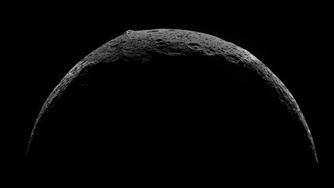 Top left, view of the equatorial mountain ridge on Saturn's moon Iapetus, taken by Cassini in 2007.