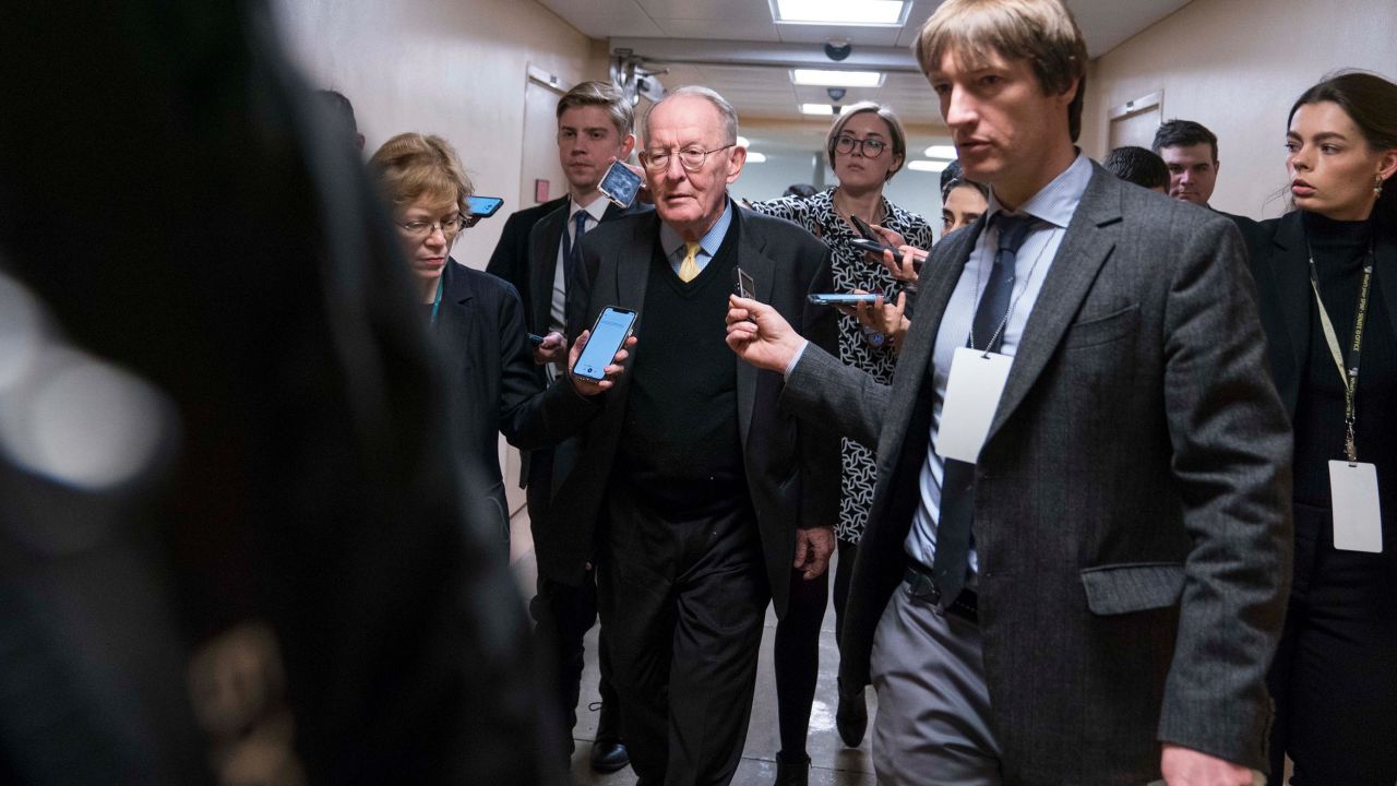 Sen. Lamar Alexander (R-TN) walks from the Senate subway to the Senate chamber to cast a vote in the Senate impeachment trial of President Donald Trump.