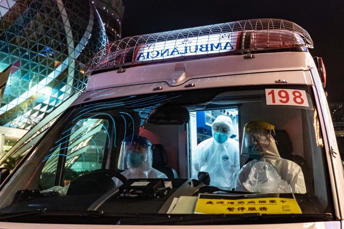 An ambulance stops at a traffic light in front of the Grand Lisboa Hotel in Macao. The virus turned China's gambling mecca <a href="index.php?page=&url=https%3A%2F%2Fwww.cnn.com%2F2020%2F02%2F03%2Fasia%2Fchina-virus-macao-gambling-intl-hnk%2Findex.html" target="_blank">into a ghost town.</a>