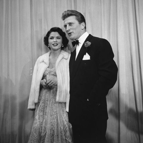 Douglas escorts Irene Wrightsman McEvoy to the Academy Awards in March 1950. He was nominated that year for best actor for his breakout role in "Champion." He would also be nominated for "The Bad and the Beautiful" and "Lust for Life." He received an honorary Academy Award in 1996.