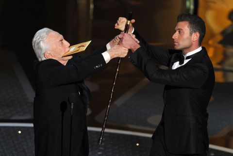Douglas helps present an Academy Award in 2011.