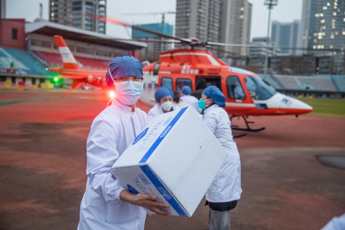 Medical staff carry medical materials from a helicopter in Wuhan, China, on February 1, 2020.