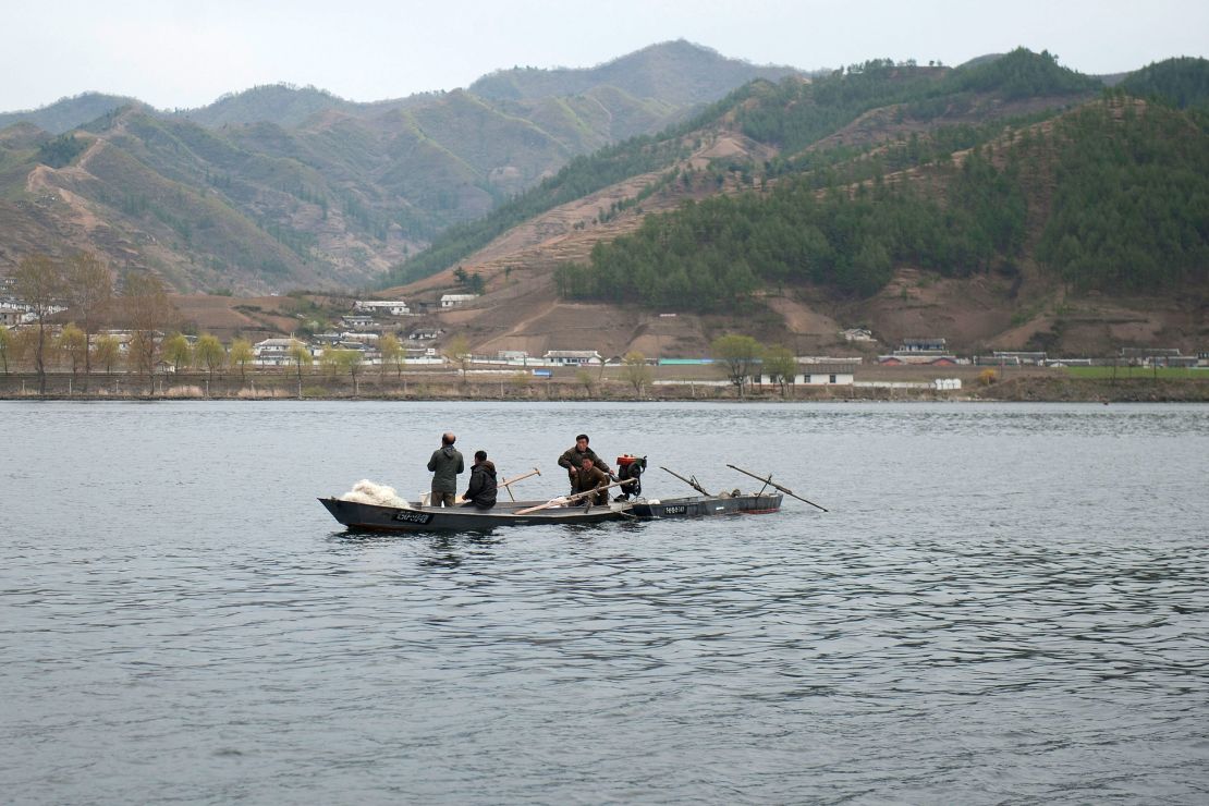 North Koreans ride boats in Yalu River, the border river shared with China, in Qingcheng, North Korea as seen from across the border on April 29, 2019, in Dandong, China.