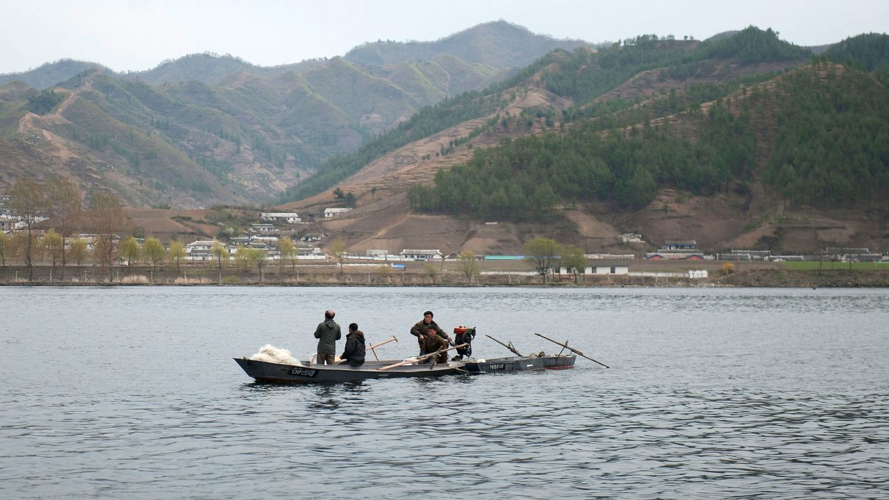 North Koreans ride boats in Yalu River, the border river shared with China, in Qingcheng, North Korea as seen from across the border on April 29, 2019, in Dandong, China.