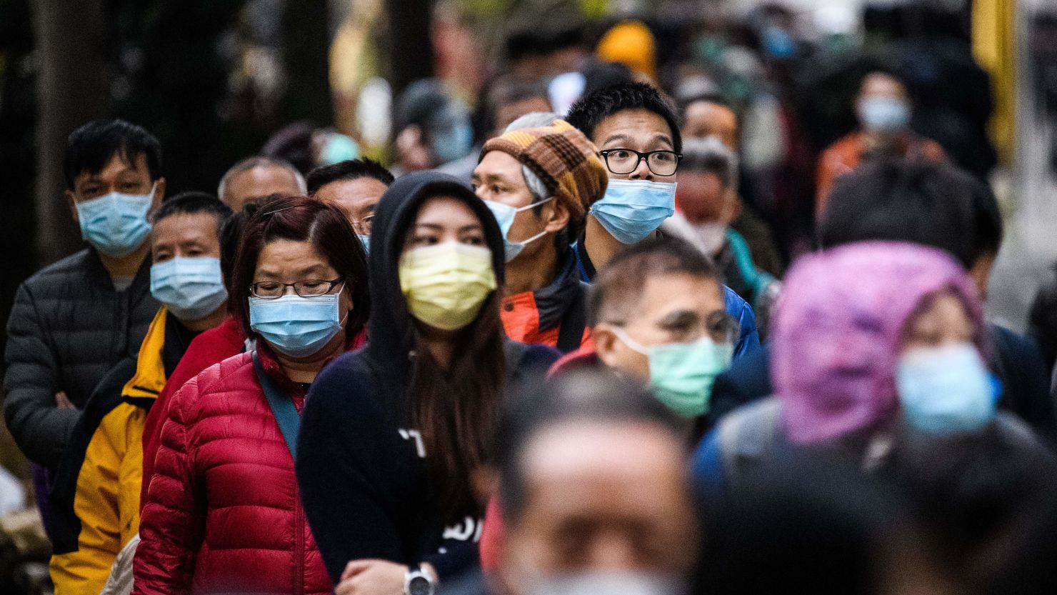 People wearing face masks following a coronavirus outbreak which began in the Chinese city of Wuhan.