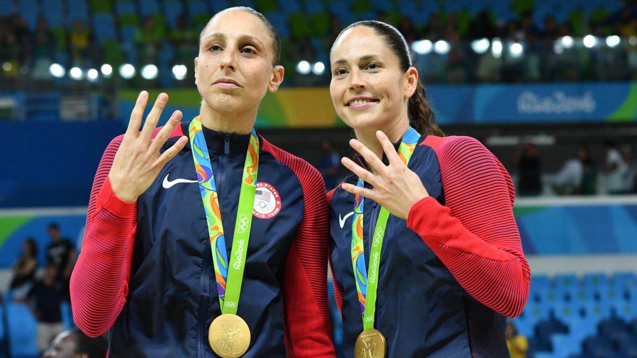 USA pair Diana Taurasi (L) and Sue Bird pose with their gold medals after the final of the women's basketball competition at the Carioca Arena 1 in the 2016 Olympics Games in Rio.