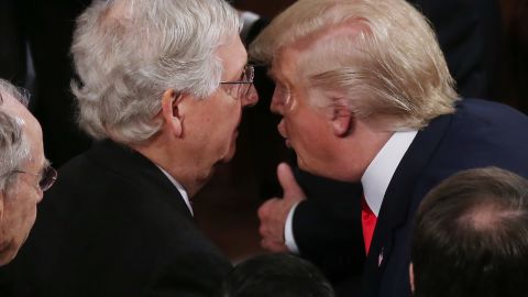 President Donald Trump (R) greets Sen. Mitch McConnell (R-KY) after delivering his State of the Union address in the chamber of the US House of Representatives on February 4, 2020.
