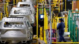 Workers assemble cars at the newly renovated Ford's Assembly Plant in Chicago, June 24, 2019. - The plant was revamped to build the Ford Explorer, Police Interceptor Utility and Lincoln Aviator. (Photo by JIM YOUNG / AFP)        (Photo credit should read JIM YOUNG/AFP via Getty Images)
