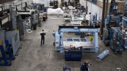 Employees work on the factory floor at the Diversified Machine Systems LLC (DMS) manufacturing facility in Colorado Springs, Colorado, U.S., on Tuesday, Sept. 24, 2019. Businesses across America are straining to cope with import taxes and protectionism under the Trump administration, which next week hosts senior Chinese officials for the highest level talks since July  and just days before another threatened tariff increase. Photographer: Rachel Woolf/Bloomberg via Getty Images