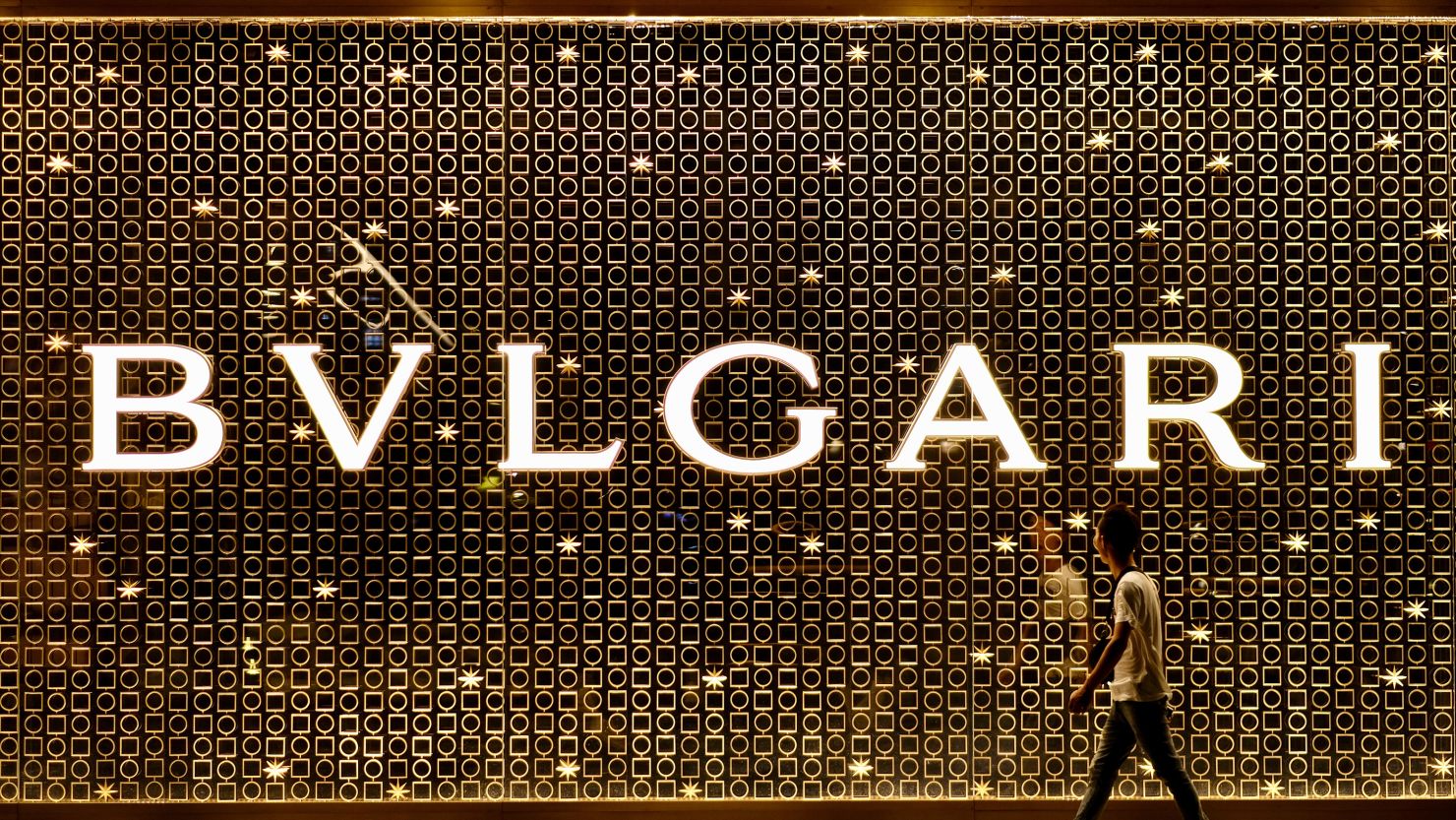 A man walks past a Bvlgari's store in Shanghai, China in July 2019.