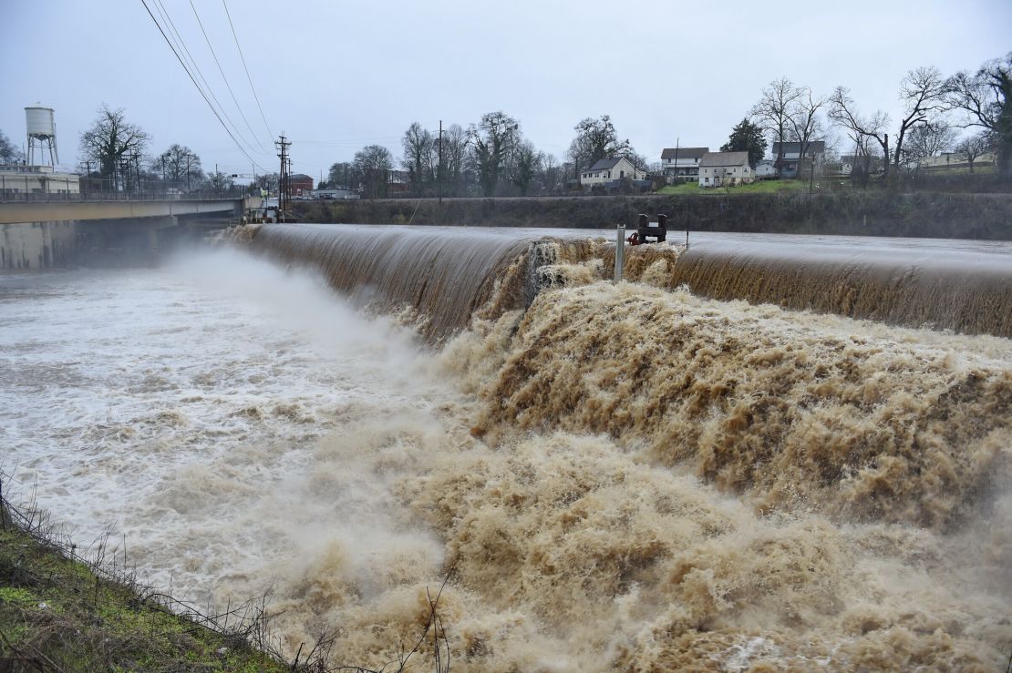 The Saluda River rages over a spillway after inches of rain fell in Pelzer, South Carolina, on Thursday, 