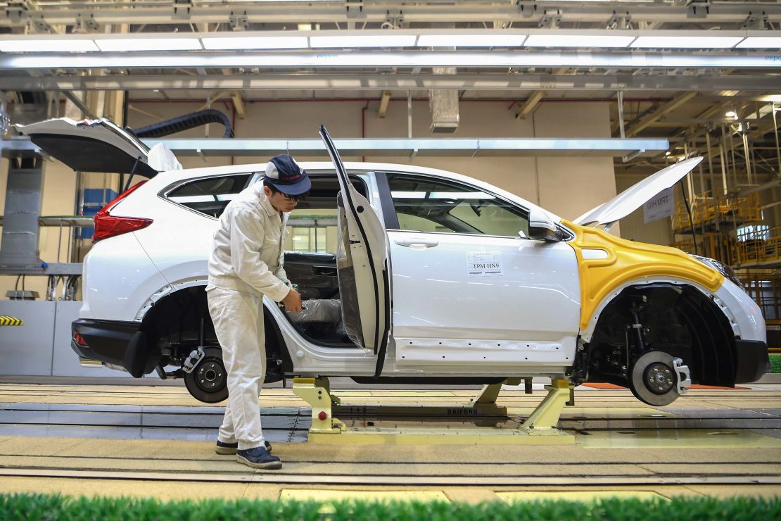 An employee works on an assembly line at Dongfeng Honda in Wuhan.