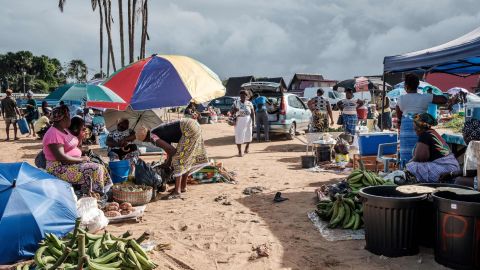 Produce sellers create a makeshift market located on the shore in Saint-Laurent du Maroni, Guyane.