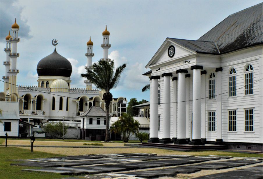 <strong>Diverse history:</strong> In the neighboring country of Suriname, the diverse population is reflected in Neveh Shalom Synagogue, right, and Keizerstraat Mosque in Paramaribo.
