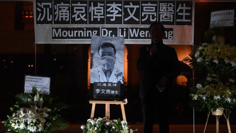 People attend a vigil in Hong Kong on February 7, 2020 for  whistleblowing doctor Li Wenliang, 34, who died in Wuhan after contracting the virus while treating a patient. 