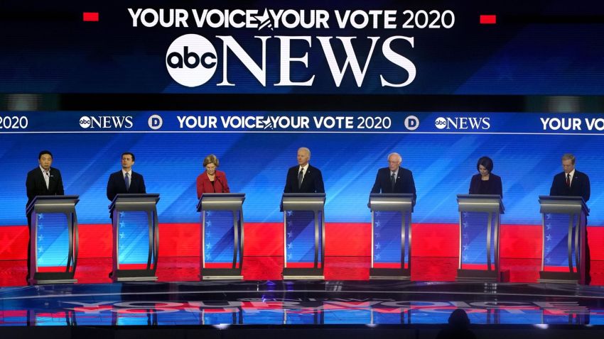 (From L) Democratic presidential hopefuls entrepreneur Andrew Yang, former Mayor of South Bend, Indiana, Pete Buttigieg, Massachusetts Senator Elizabeth Warren, former Vice President Joe Biden, Vermont Senator Bernie Sanders, Minnesota Senator Amy Klobuchar and Billionaire activist Tom Steyer arrive onstage for the eighth Democratic primary debate of the 2020 presidential campaign season co-hosted by ABC News, WMUR-TV and Apple News at St. Anselm College in Manchester, New Hampshire, on February 7, 2020. (Photo by TIMOTHY A. CLARY / AFP) (Photo by TIMOTHY A. CLARY/AFP via Getty Images)