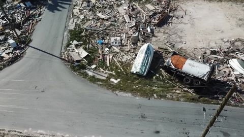 Wrecked vehicles, boats and piles of debris line streets in Marsh Harbor, Bahamas.