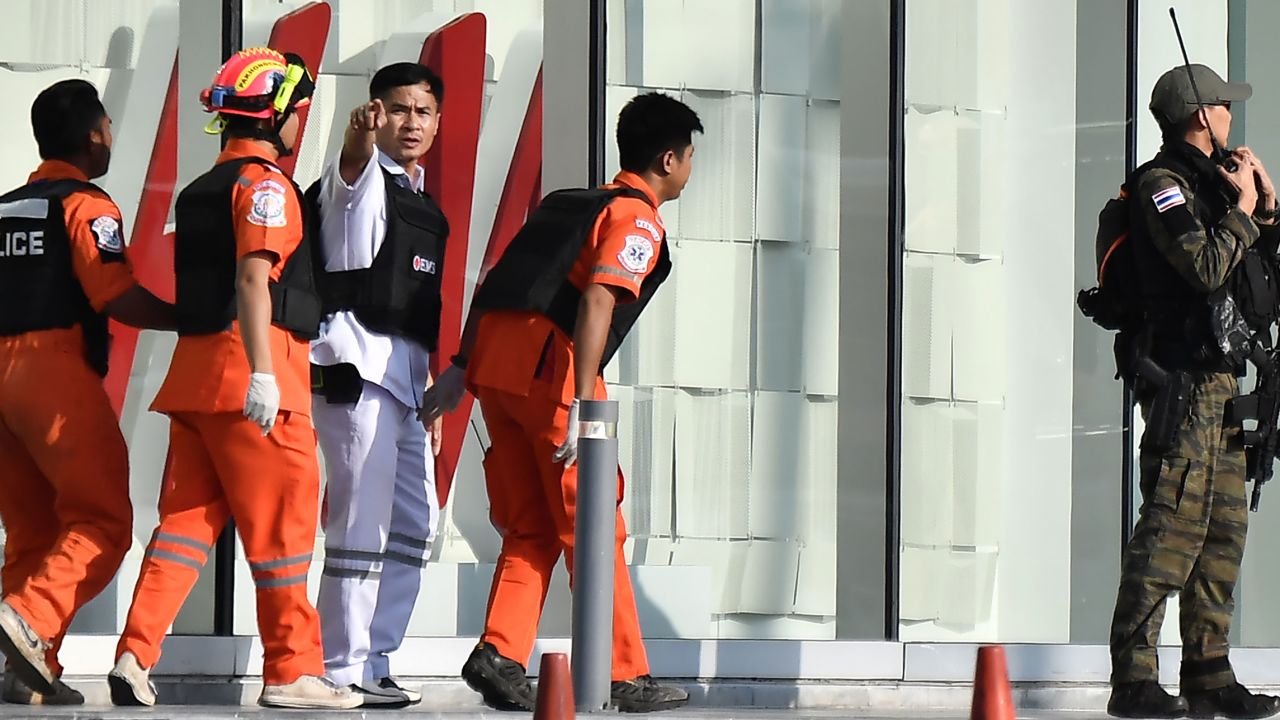 Medics prepare to enter the Terminal 21 mall where Saturday's mass shooting took place.