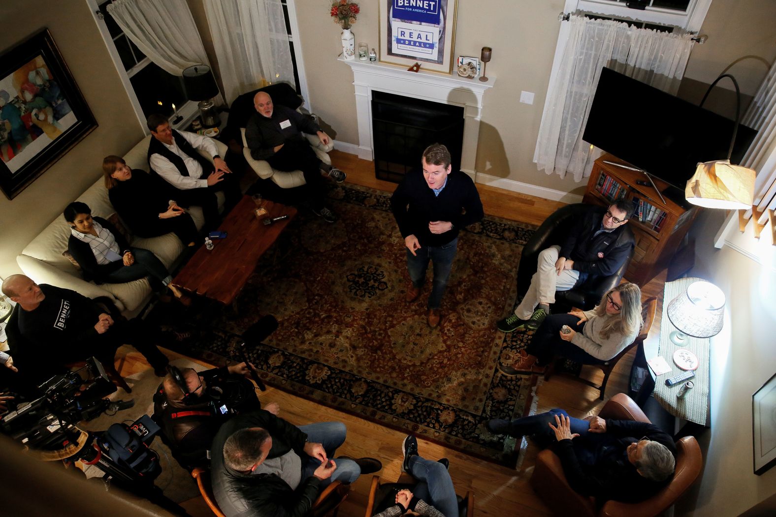 US Sen. Michael Bennet speaks to voters at a house party in Merrimack on Saturday, February 1.