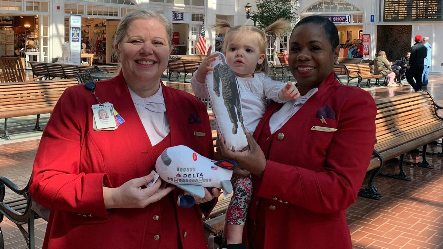 Two Delta Red Coats made sure the doll didn't have to fly alone! 