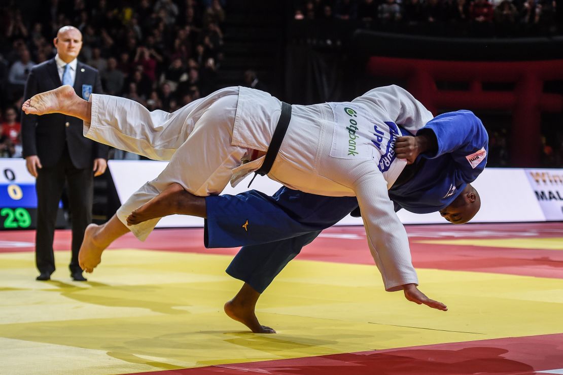 Teddy Riner (R) fights against Japan's Kokoro Kageura in the over 100 kg category at the Paris Grand Slam.
