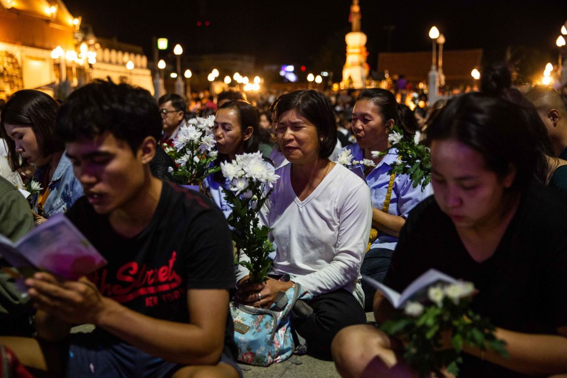 Mourners attend a vigil for victims of the mall shooting on Sunday in Korat, Thailand. 