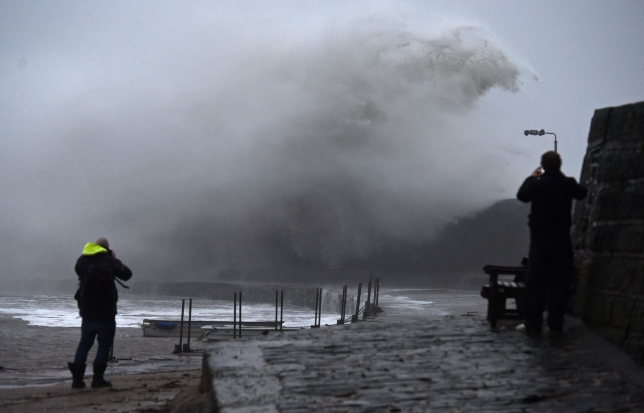 Storm Ciara causes large waves in Lyme Regis, in southwestern England, on Sunday.