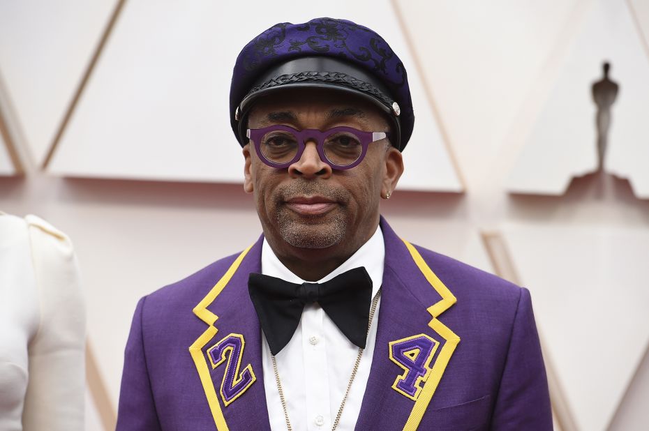 Director and Oscar-winner Spike Lee arrives in a touching Kobe Bryant tribute tux. The purple outfit shows the late basketball player's number, 24, embroidered on the lapels. 