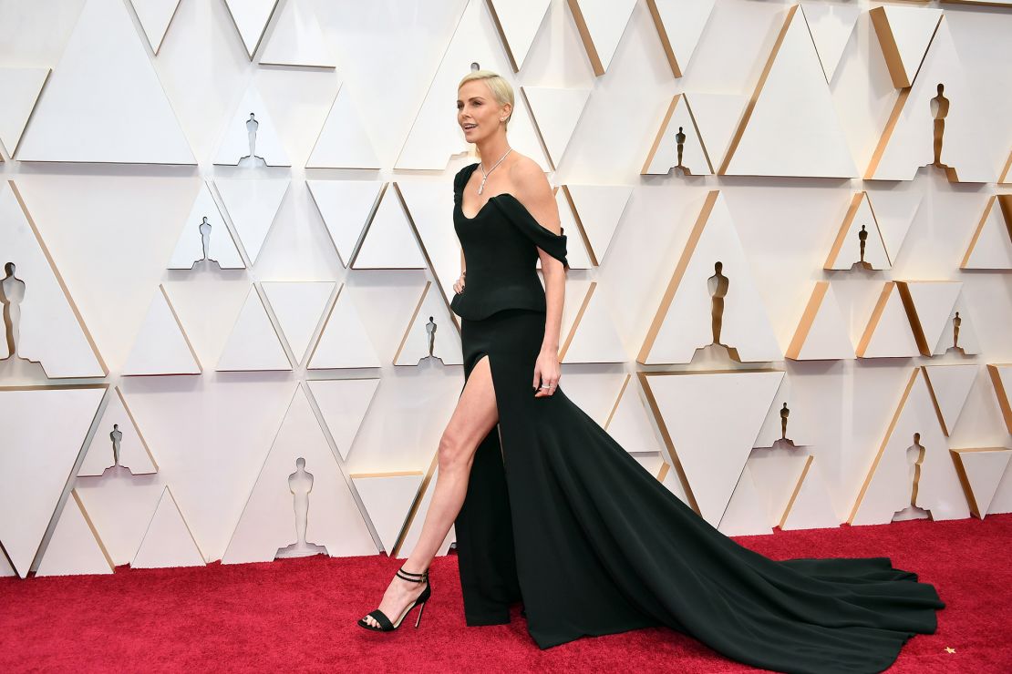Charlize Theron opted for a classic look in a custom single-shoulder Dior gown with thigh-high slit.