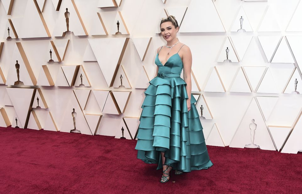 For her very first Oscars appearance, Florence Pugh has chosen a teal satin dress. Pugh is a first-time Oscar nominee for her role as Amy March in Greta Gerwig's Little Women.