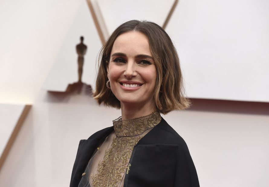Natalie Portman, in Dior Haute Couture, has a cape embroidered with names of women in the industry, "who were not represented for their incredible work this year." Names include Scafaria, Wang, Gerwig, Diop, Heller, Matsoukas, Ha'rel and Sciamma. 