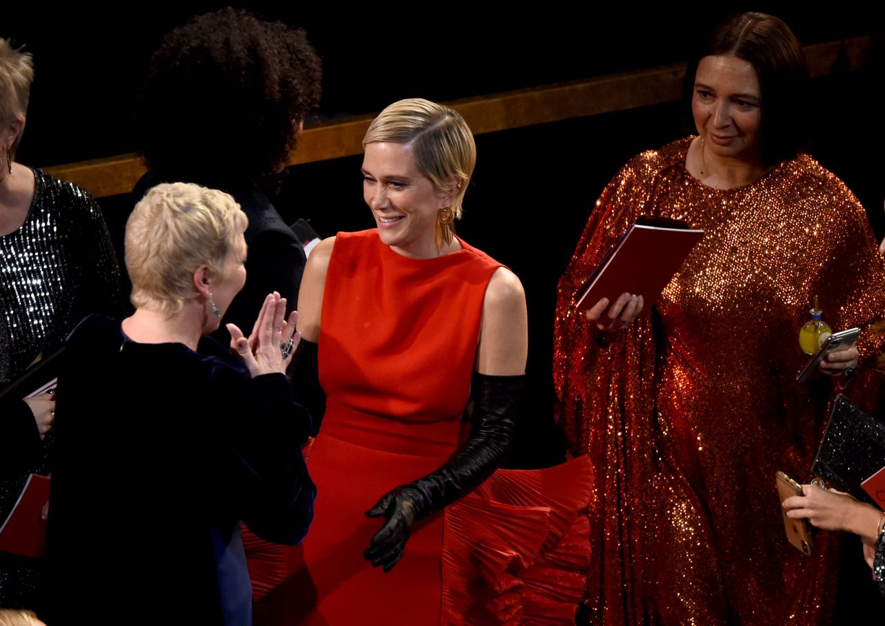From left, actresses Olivia Colman, Kristen Wiig and Maya Rudolph are seen before the start of the show.
