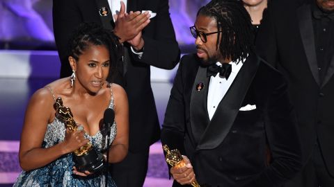 Producer Karen Rupert Toliver, left, and director Matthew A. Cherry accept the award for best animated short film for "Hair Love" during the 92nd Academy Awards at the Dolby Theatre in Hollywood, California, on Sunday.