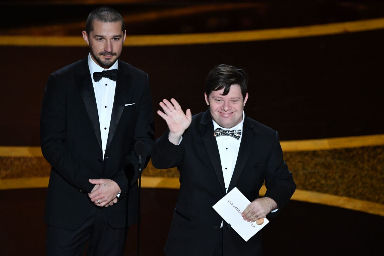 Actor Shia LaBeouf and Zack Gottsagen present an award during the show.