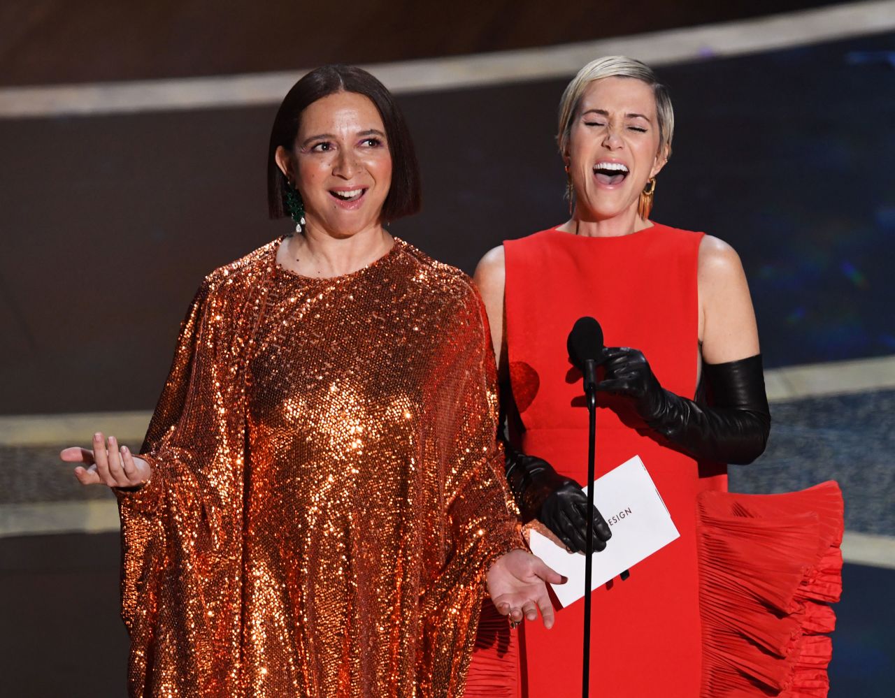 Maya Rudolph, left, and Kristen Wiig joke before presenting a couple of awards.