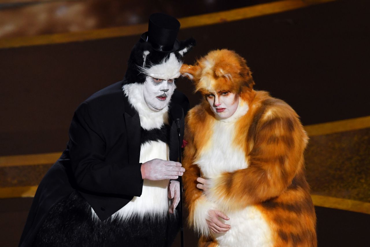 James Corden and Rebel Wilson appear in "Cats" costumes — <a href="https://www.cnn.com/entertainment/live-news/oscars-2020/h_4fa9cac660f563c1e68c0f04e0b4c6e5" target="_blank">and share a laugh at their movie's expense.</a> "Nobody more than us understands the importance of good visual effects," Corden quipped.